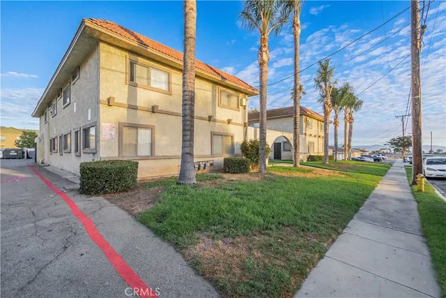 a view of a building with a yard