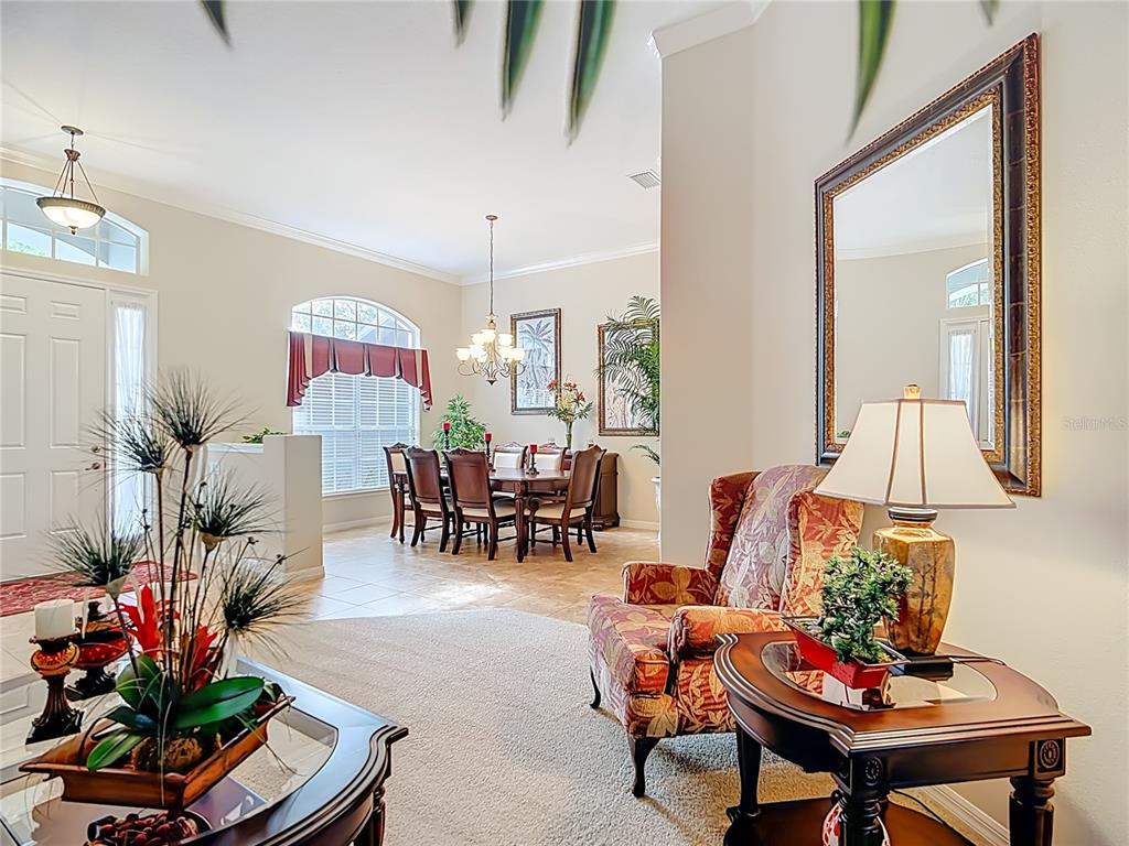 277 Magneta Loop Auburndale, FL 33823 - Photo 16 of 58 a living room with furniture and a potted plant
