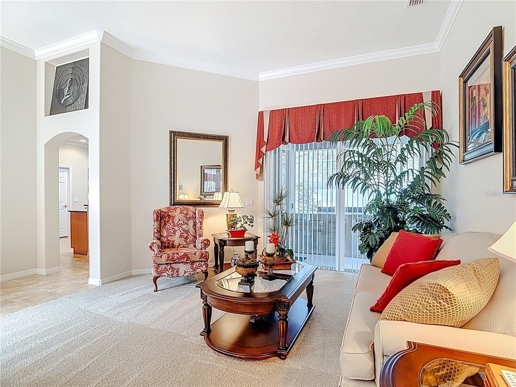 277 Magneta Loop Auburndale, FL 33823 - Photo 17 of 58 a living room with furniture and a potted plant