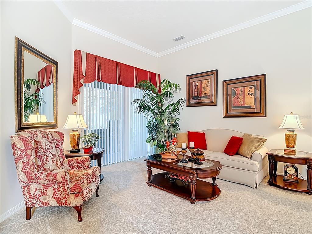 277 Magneta Loop Auburndale, FL 33823 - Photo 19 of 58 a living room with furniture and a large window
