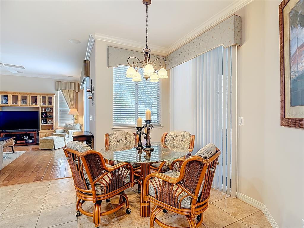277 Magneta Loop Auburndale, FL 33823 - Photo 21 of 58 a dining room with furniture and a chandelier