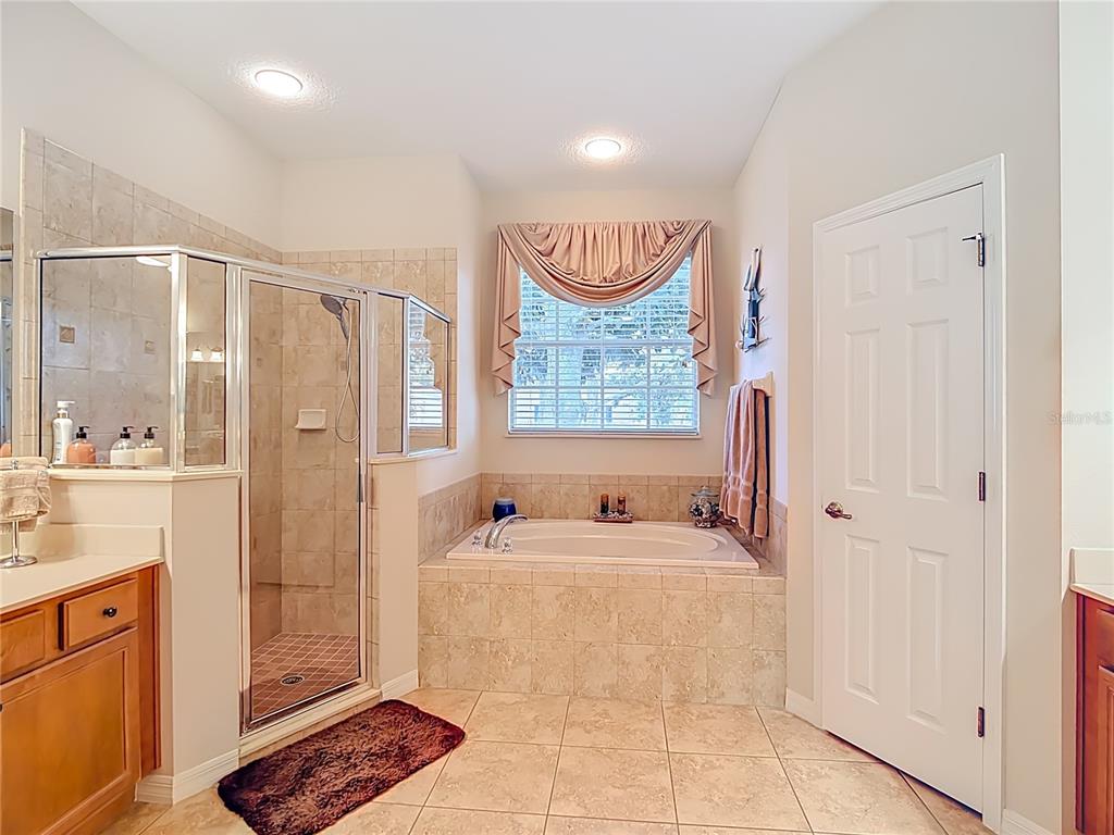 277 Magneta Loop Auburndale, FL 33823 - Photo 26 of 58 a bath room with a sink and a mirror