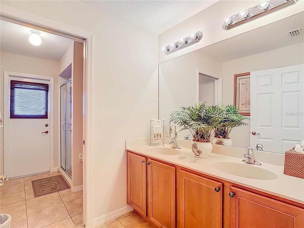 277 Magneta Loop Auburndale, FL 33823 - Photo 34 of 58 a bathroom with a sink and a mirror