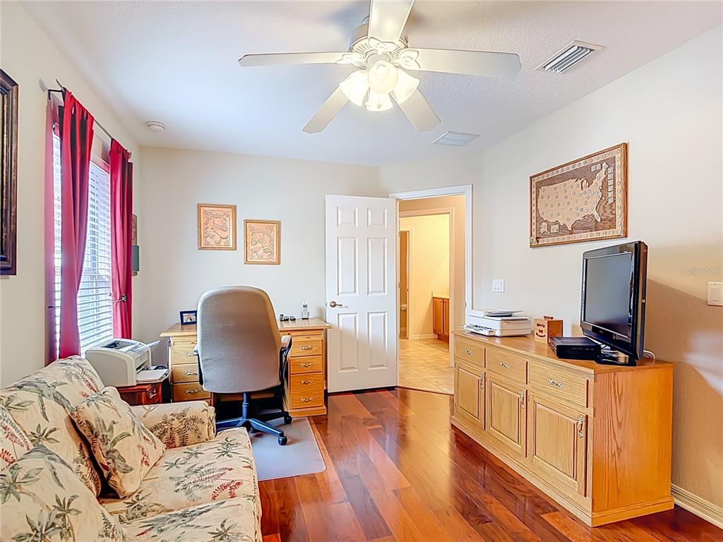 277 Magneta Loop Auburndale, FL 33823 - Photo 36 of 58 a living room with furniture and a flat screen tv