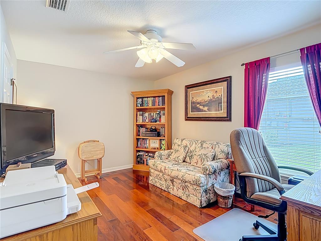 277 Magneta Loop Auburndale, FL 33823 - Photo 37 of 58 a living room with furniture and a flat screen tv