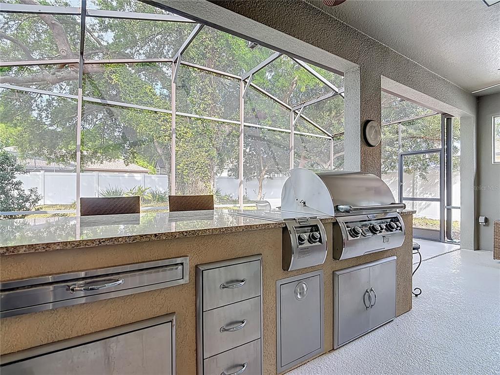 277 Magneta Loop Auburndale, FL 33823 - Photo 39 of 58 a kitchen with appliances cabinets and a sink