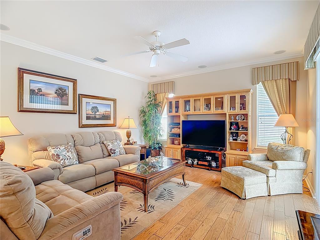 277 Magneta Loop Auburndale, FL 33823 - Photo 4 of 58 a living room with furniture and a flat screen tv