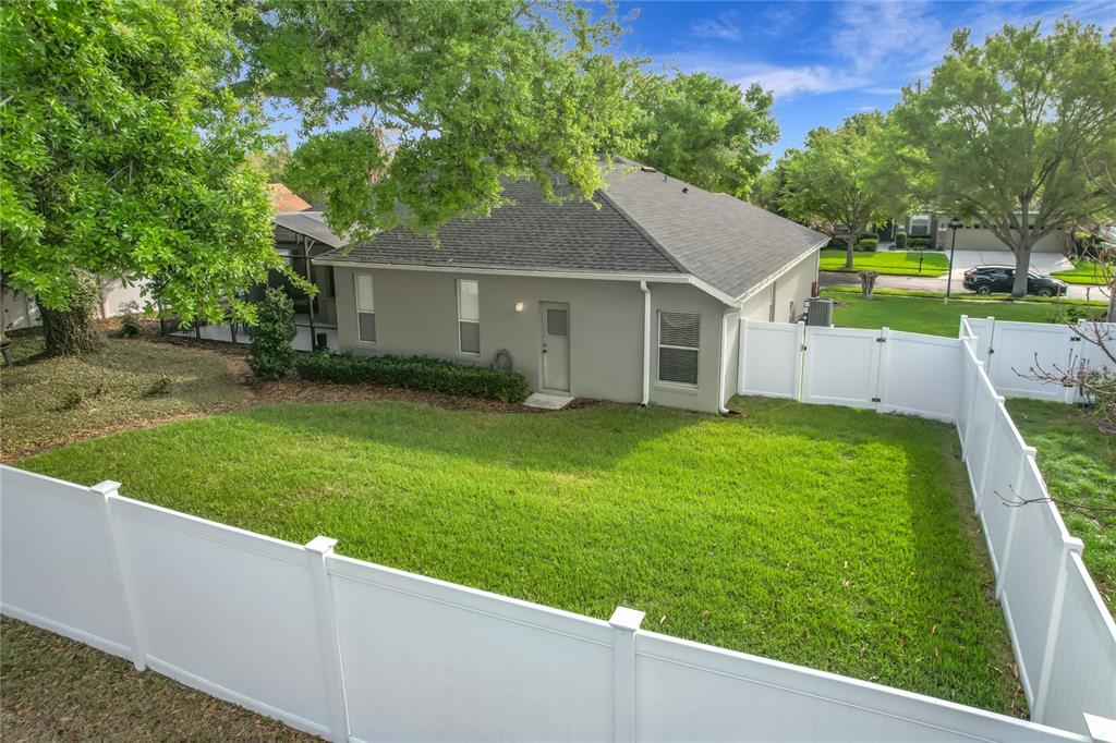 277 Magneta Loop Auburndale, FL 33823 - Photo 47 of 58 a view of a house with a yard and a large tree