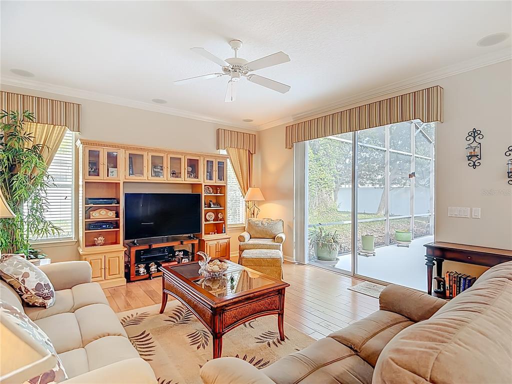 277 Magneta Loop Auburndale, FL 33823 - Photo 5 of 58 a living room with furniture and a flat screen tv