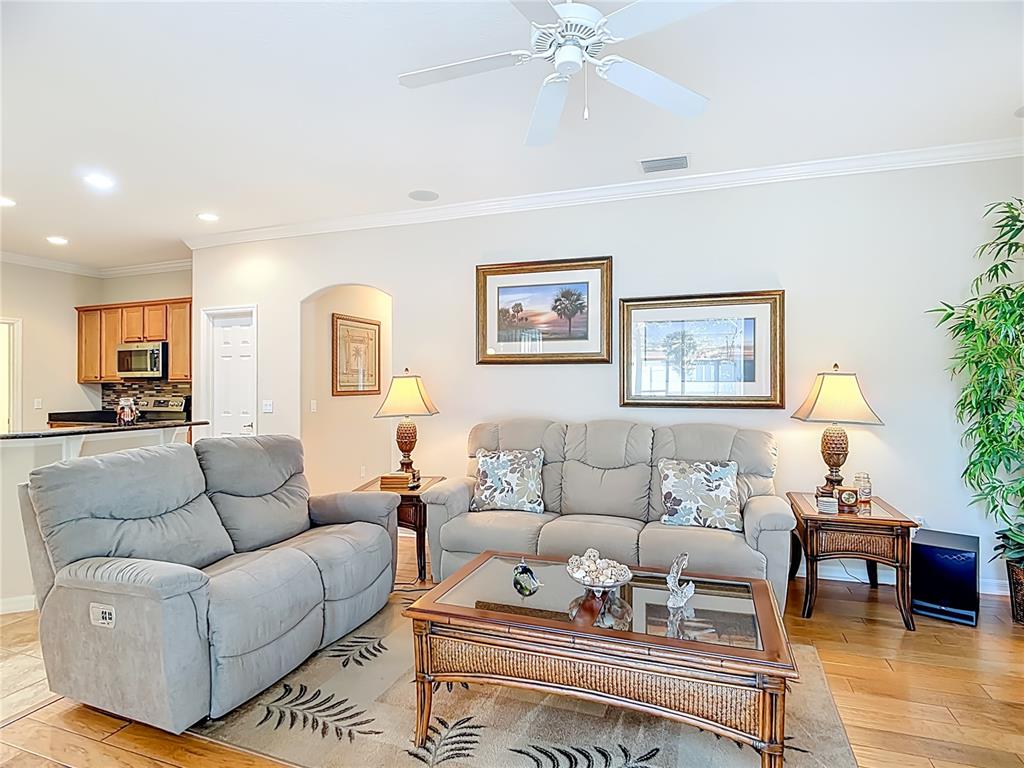 277 Magneta Loop Auburndale, FL 33823 - Photo 6 of 58 a living room with furniture and a view of kitchen