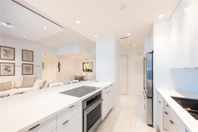a bedroom with furniture and a flat screen tv