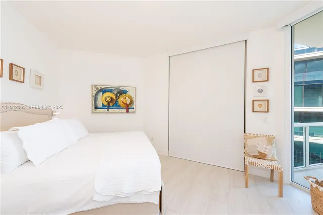 a bathroom with a double vanity sink mirror and shower
