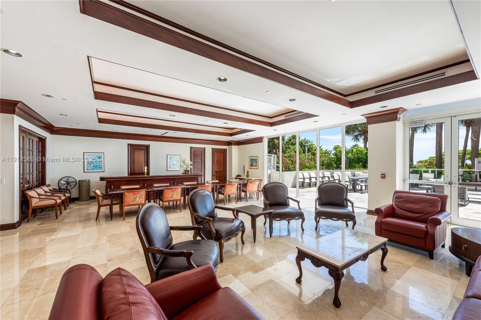 8925 Collins Avenue, Unit 11C Surfside, FL 33154 - Photo 33 of 36 a living room with furniture and a large window
