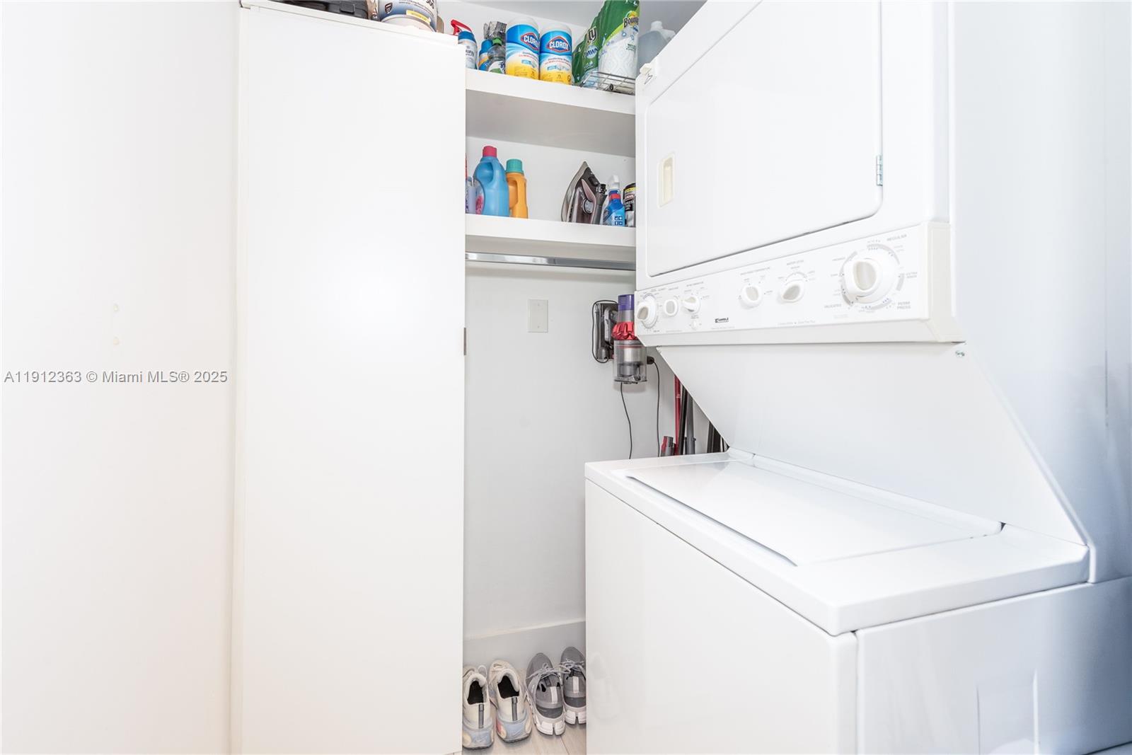 8925 Collins Avenue, Unit 11C Surfside, FL 33154 - Photo 35 of 36 a utility room with dryer and washer