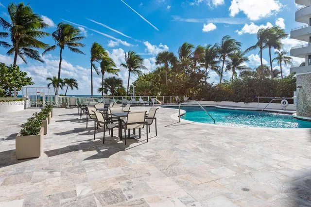 a view of a swimming pool with a patio