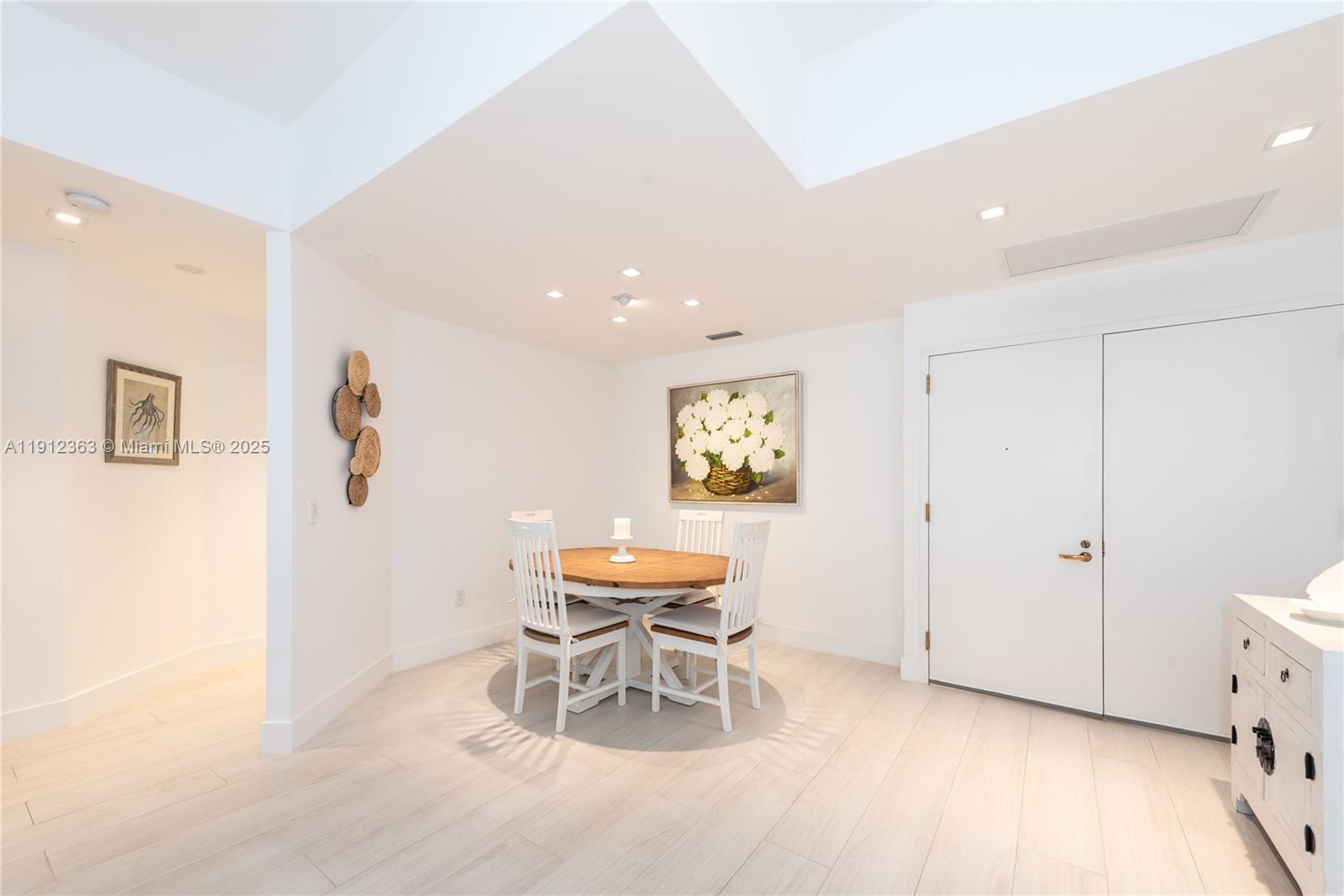 8925 Collins Avenue, Unit 11C Surfside, FL 33154 - Photo 6 of 36 a view of a room with furniture and wooden floor