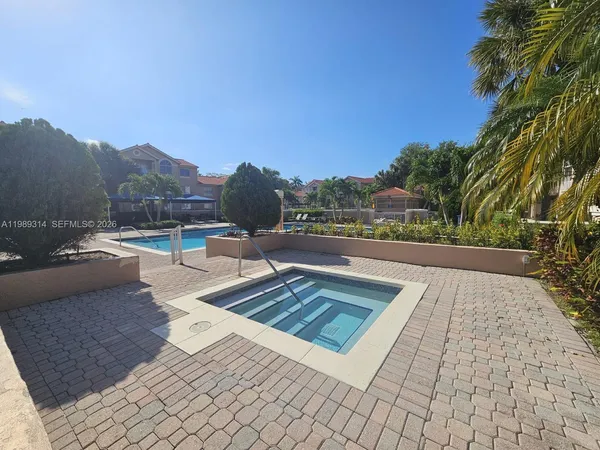 a view of swimming pool with a lounge chair