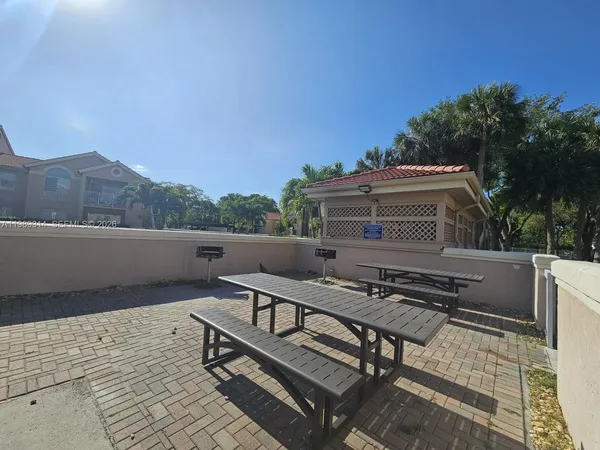 a terrace of a house with outdoor seating