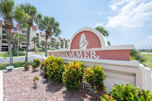 a view of a sign board with a small yard