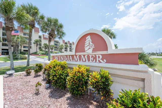 a view of a sign board with a small yard