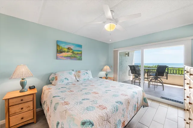 a bedroom with a bed and a view of bedroom