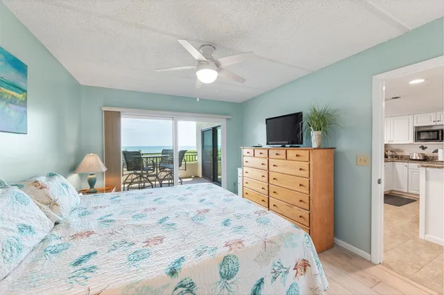 a bed room with a bed and a television