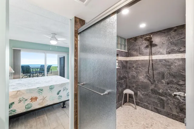 a bathroom with a bathtub and a shower