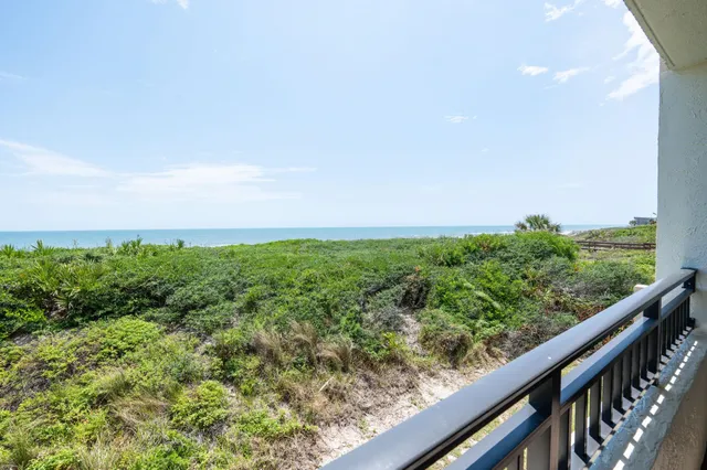 a view of a garden from a balcony