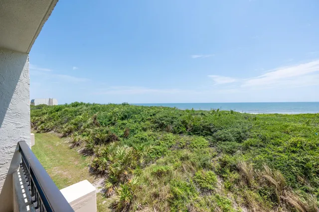 a view of a garden from a balcony