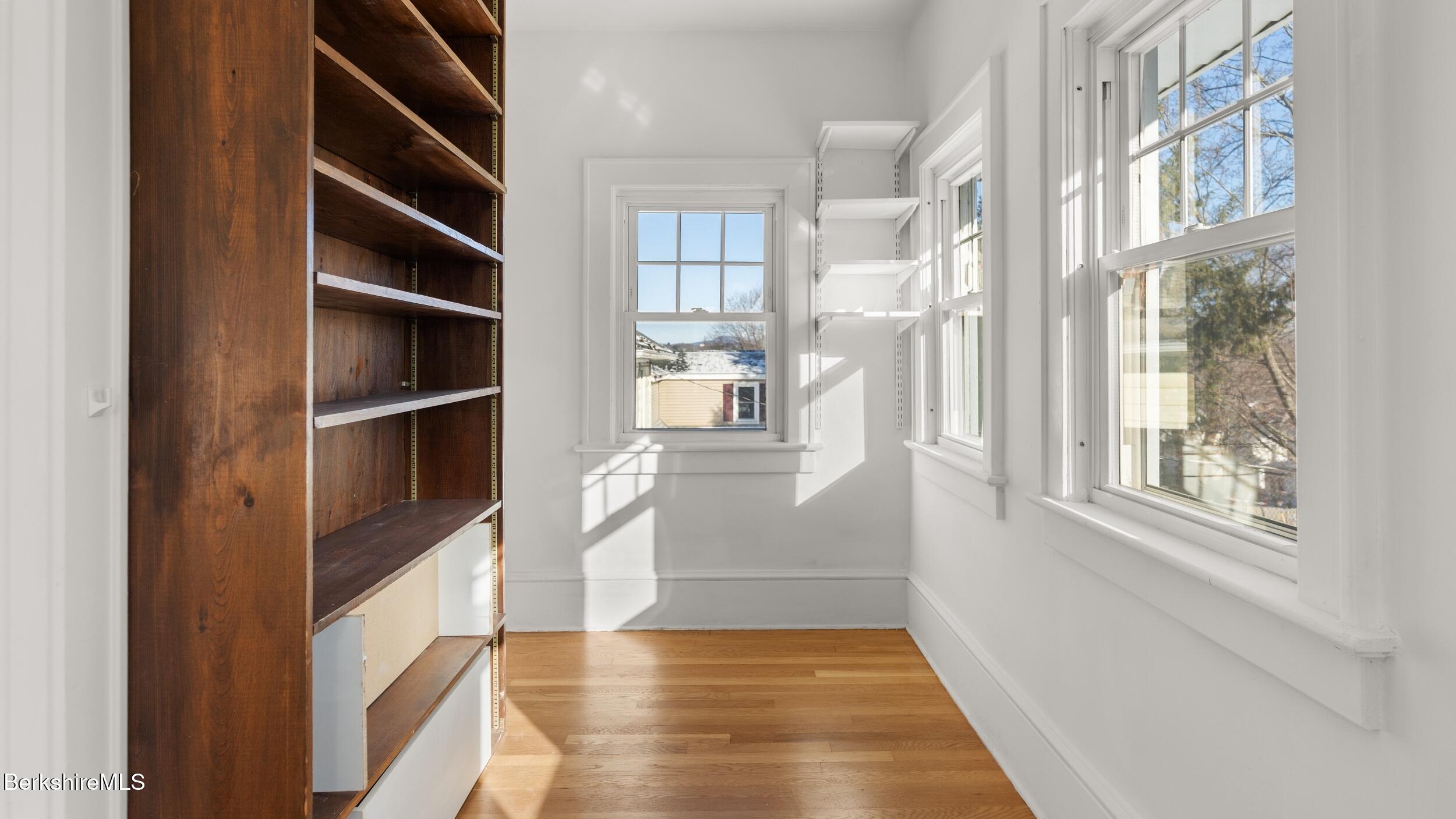 121 Edward Avenue Pittsfield, MA 01201 - Photo 13 of 22 a view of an empty room with cabinet and a window