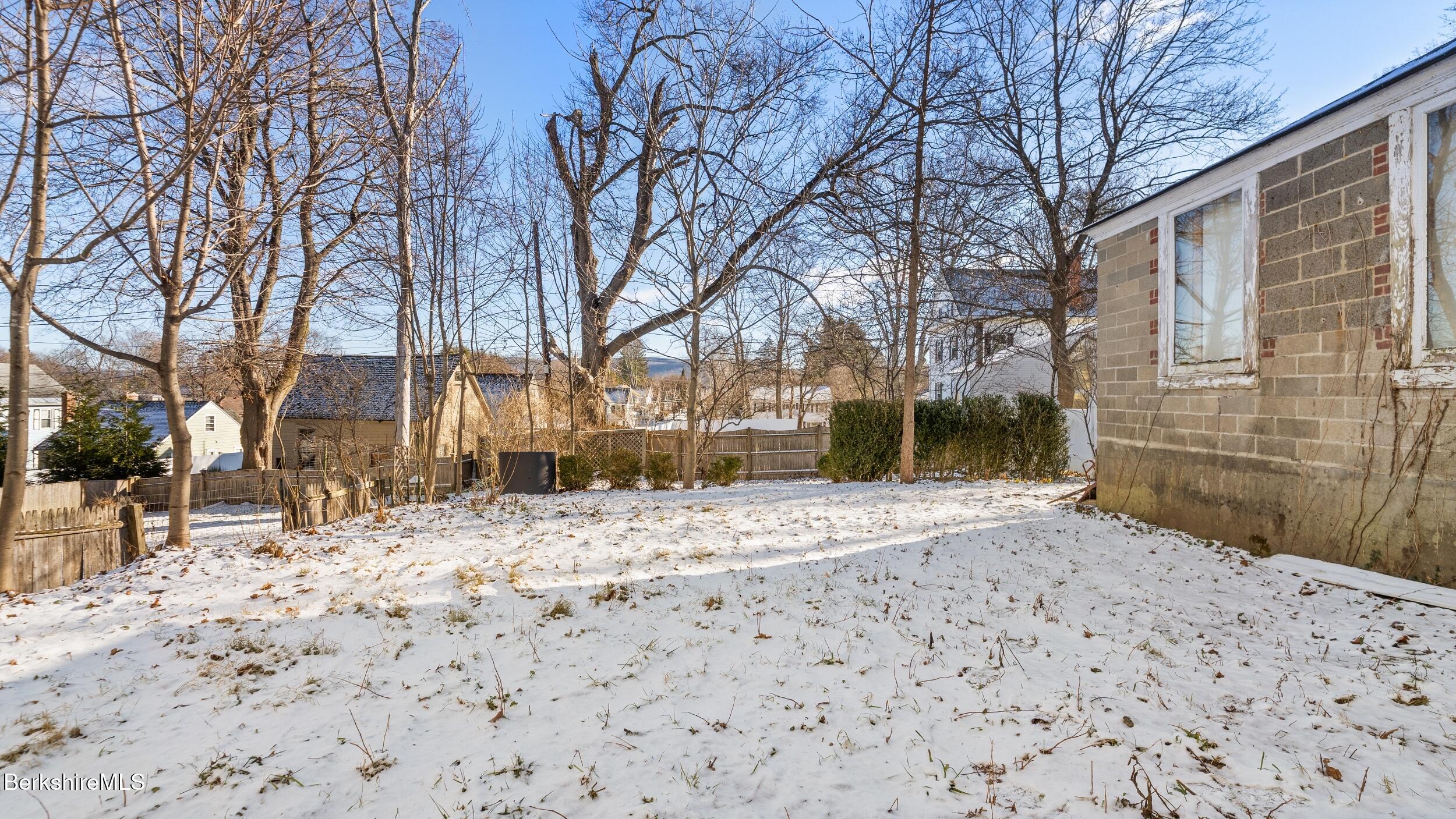 121 Edward Avenue Pittsfield, MA 01201 - Photo 2 of 22 a view of a house with a yard covered in snow