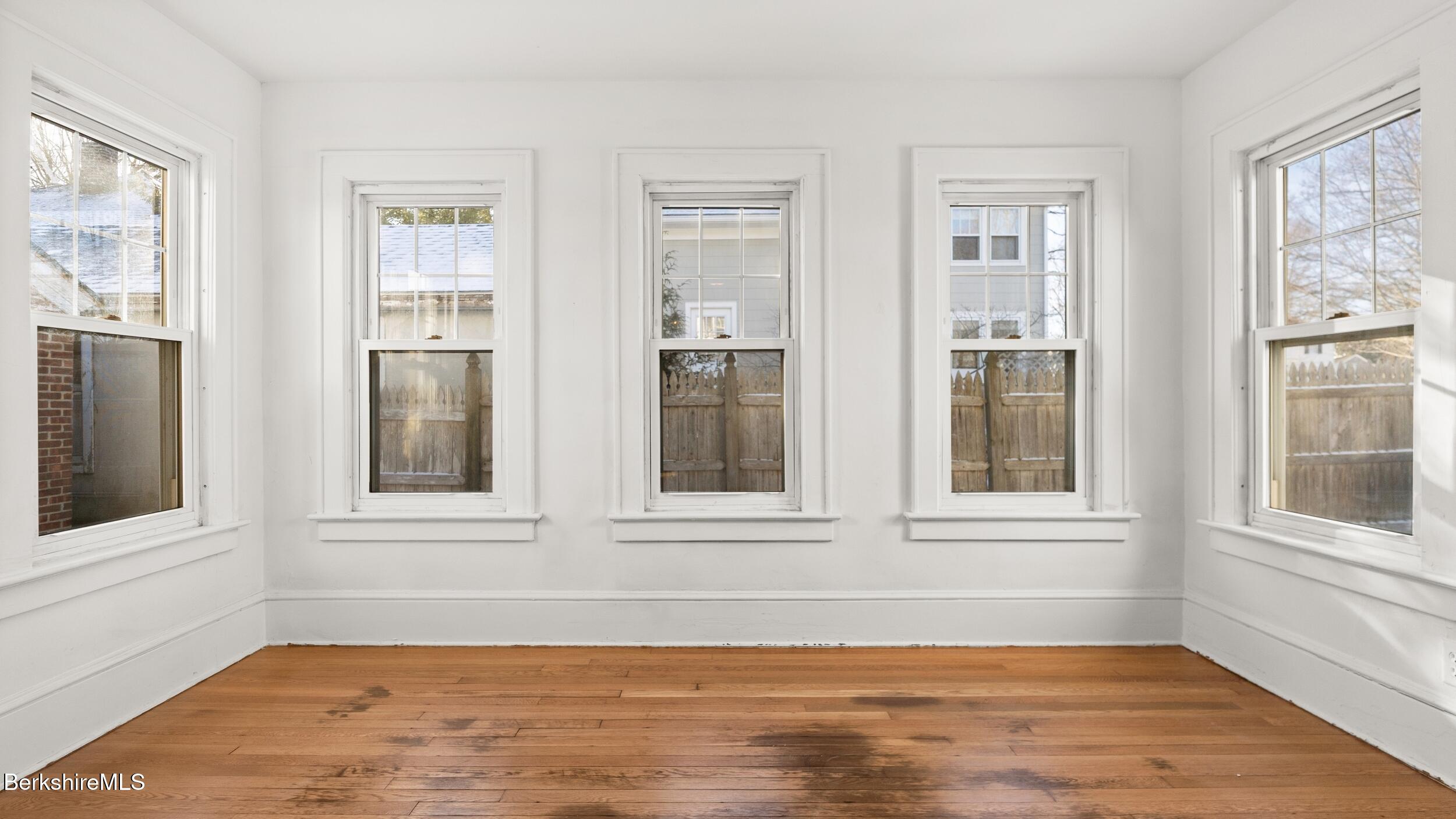 121 Edward Avenue Pittsfield, MA 01201 - Photo 21 of 22 a view of an empty room with wooden floor and a window