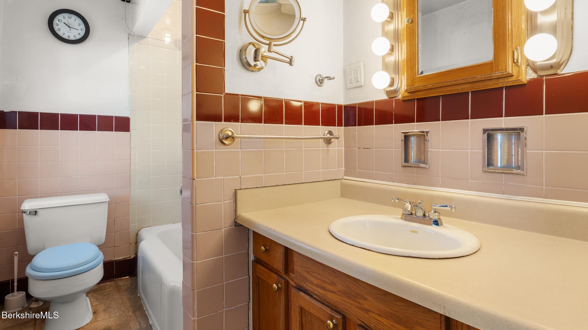 121 Edward Avenue Pittsfield, MA 01201 - Photo 22 of 22 a bathroom with a sink toilet and a mirror