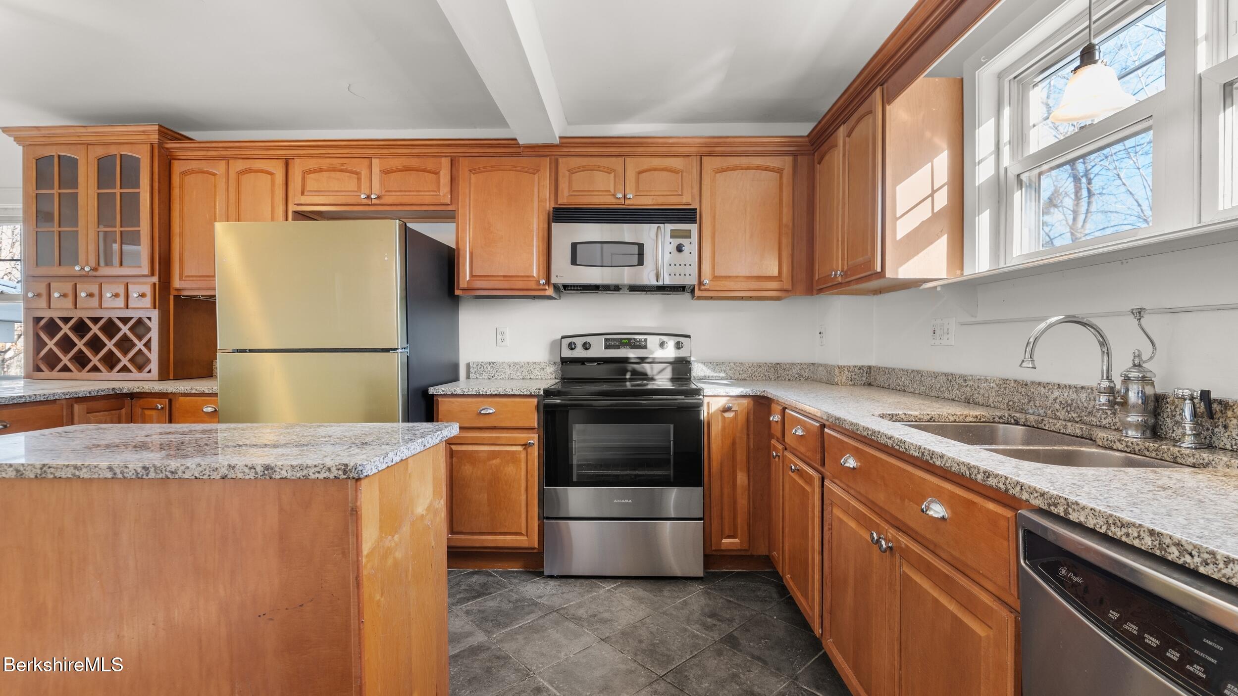121 Edward Avenue Pittsfield, MA 01201 - Photo 6 of 22 a kitchen with granite countertop a refrigerator stove and sink