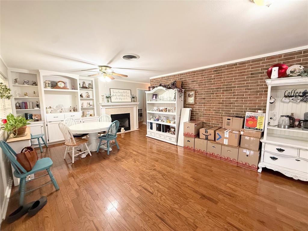 112 Meadow Lane Groesbeck, TX 76642 - Photo 12 of 37 a living room with furniture and a fireplace