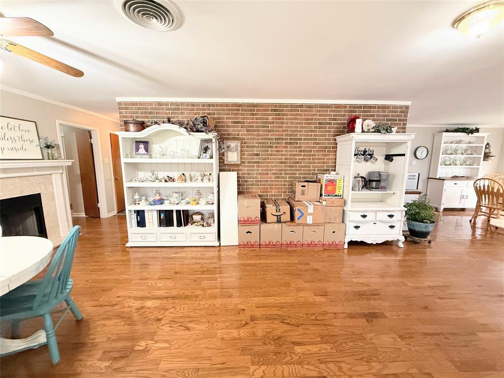 112 Meadow Lane Groesbeck, TX 76642 - Photo 13 of 37 a living room with furniture and a fireplace