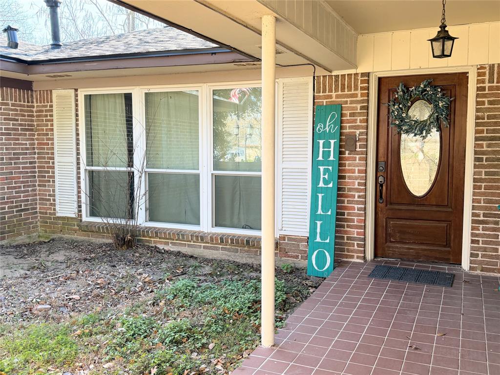 112 Meadow Lane Groesbeck, TX 76642 - Photo 2 of 37 a view of a entryway door with garden