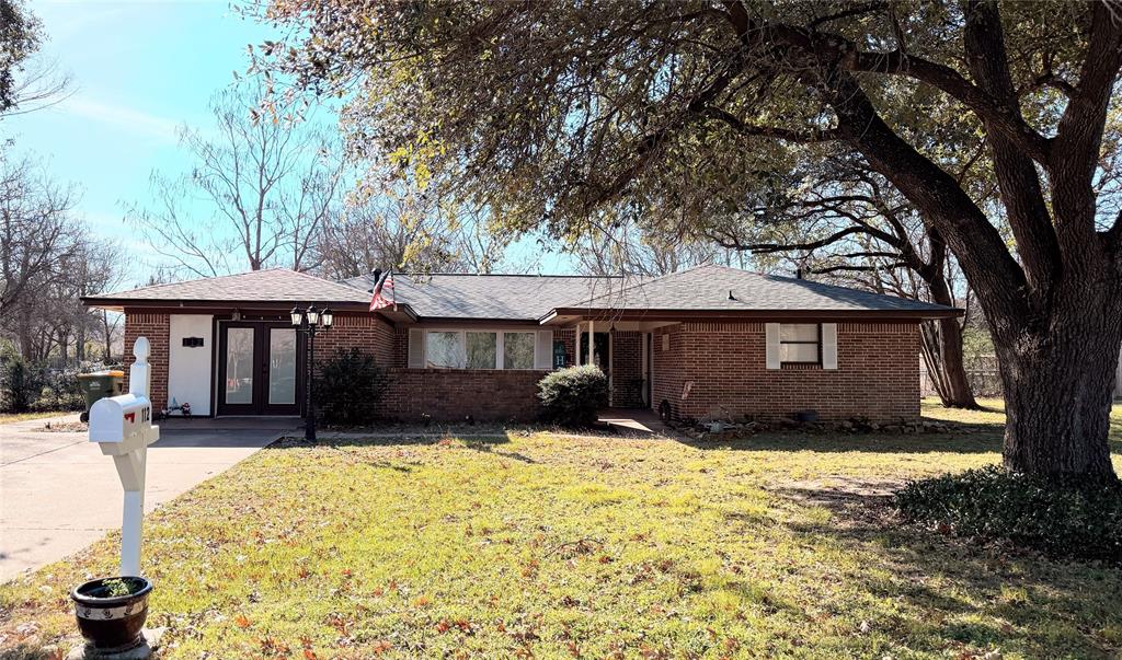 112 Meadow Lane Groesbeck, TX 76642 - Photo 37 of 37 a front view of a house with yard covered in snow