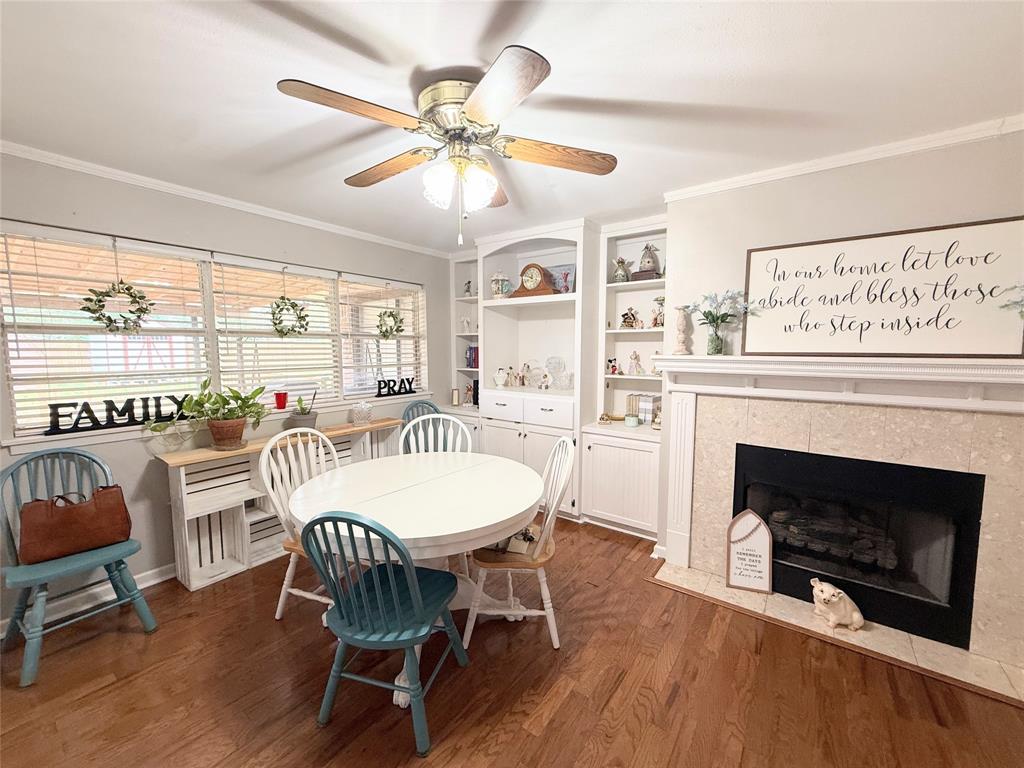 112 Meadow Lane Groesbeck, TX 76642 - Photo 9 of 37 a view of a dining room with furniture window and wooden floor