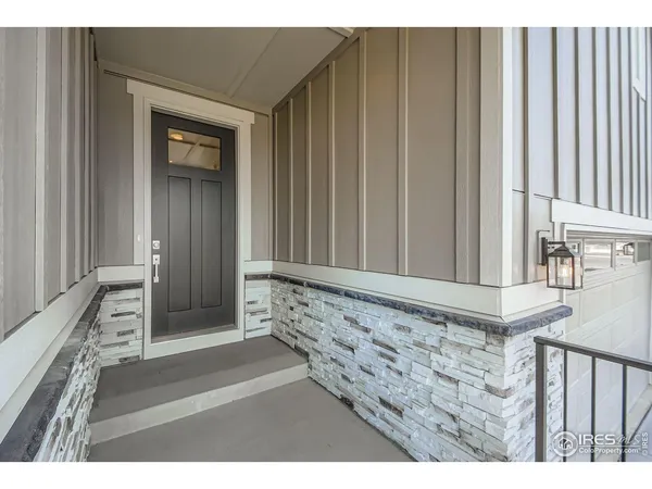 a view of a door and wooden floor
