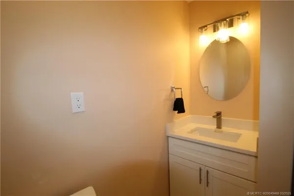 a bathroom with a sink and mirror