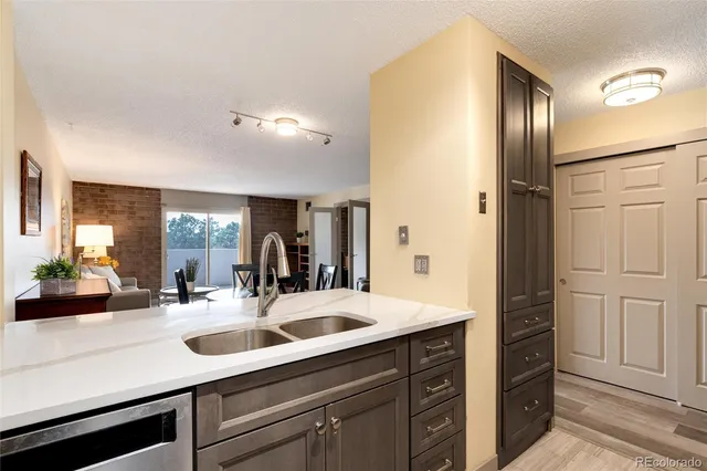 a view of a sink storage and utility room
