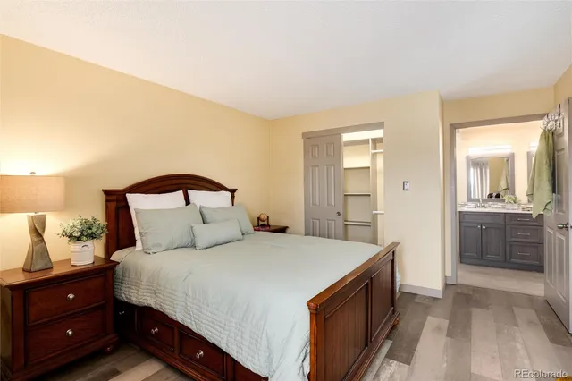 a bedroom with a bed and a view of bathroom