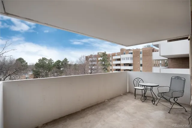a view of balcony with furniture