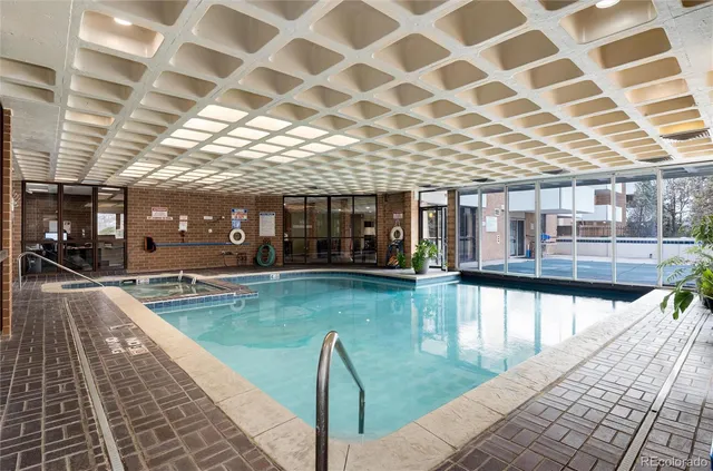 a view of a swimming pool with a patio