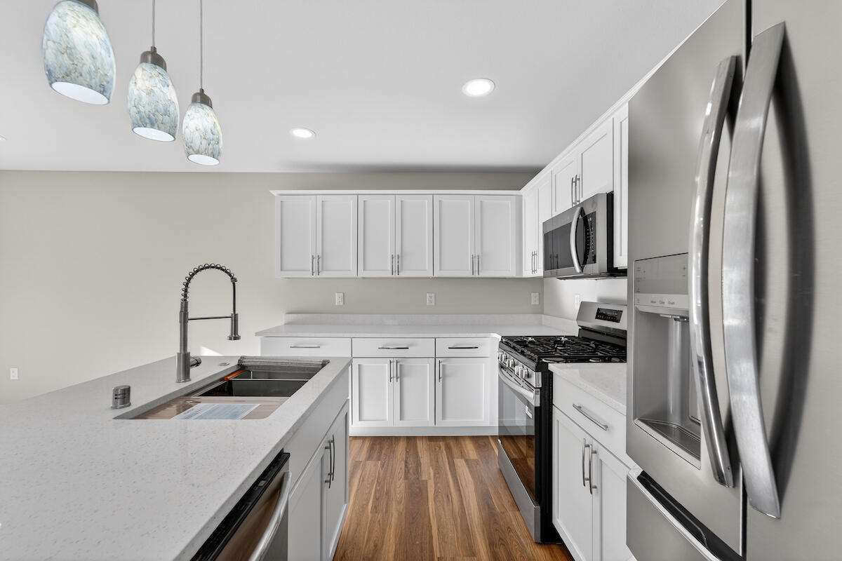 1617 Derby Avenue Mount Pleasant, WI 53403 - Photo 7 of 28 white cabinetry & quarty counter tops