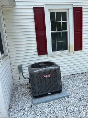 a view of a backyard with sitting area