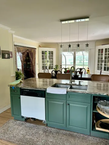 a kitchen with sink and window