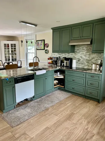 a kitchen with lots of counter top space and appliances