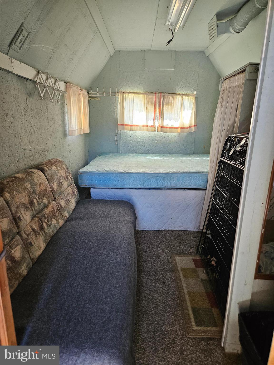 6 Boo Boo Boulevard Falling Waters, WV 25419 - Photo 12 of 19 a bed sitting in a bedroom next to a window